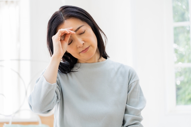 体調不良の女性